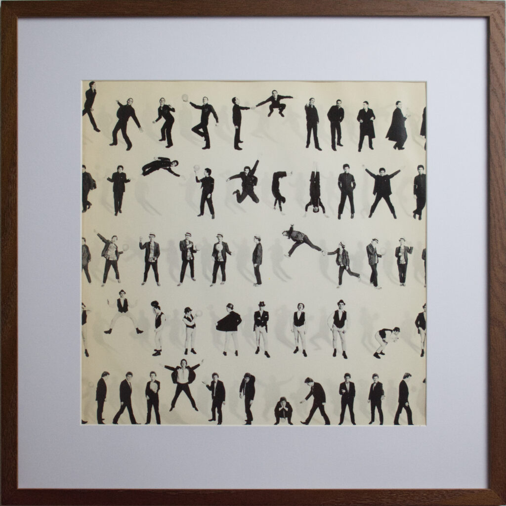 Devo Oh No It's Devo 1982 framed album sleeve - silhouette grid artwork with de-evolution imagery